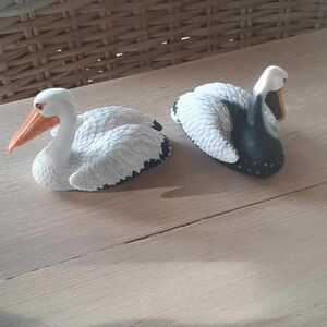 White and Black Pelican Figurines